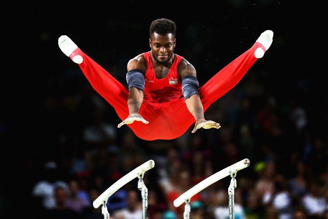 England’s Courtney Tulloch competes on the parallel bars in the men's team final and individual qualification during the Artistic Gymnastics at Coomera Indoor Sports Centre