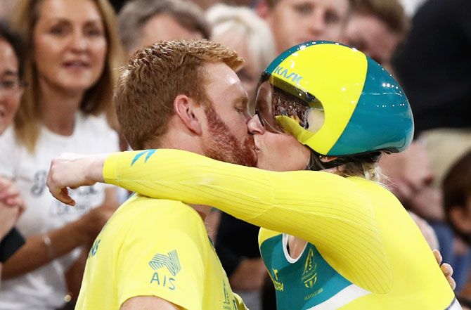 Australia’s Stephanie Morton is congratulated by her partner after winning the Women's Sprint Gold gold at Anna Meares Velodrome in Brisbane