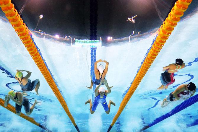 South Africa's Tatjana Schoenmaker (C) competes during the women's 200m breaststroke final at Optus Aquatic Centre 