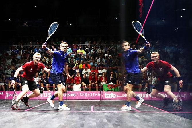 Scotland's Alan Clyne plays a backhand during his men's singles squash quarter-final match against Wales' Joel Makin at Oxenford Studios