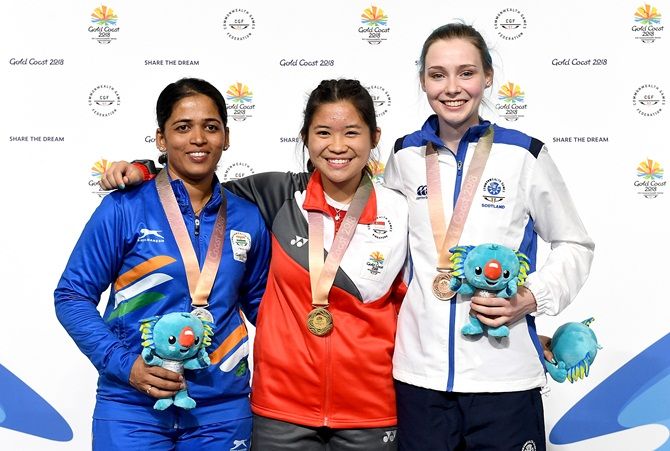 Singapore’s Martina Lindsay, India’s  Tejaswini Sawant and Seonaid McIntosh of Scotland pose with their medals after the women's 50m Rifle Prone shooting event at the Commonwealth Games on Thursday
