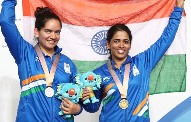 Anjum Moudgil, left, and Tejaswini Sawant