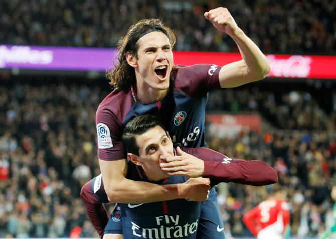 PSG's Edinson Cavani and Angel di Maria celebrate the third goal against AS Monaco in their 7-1 win on Sunday