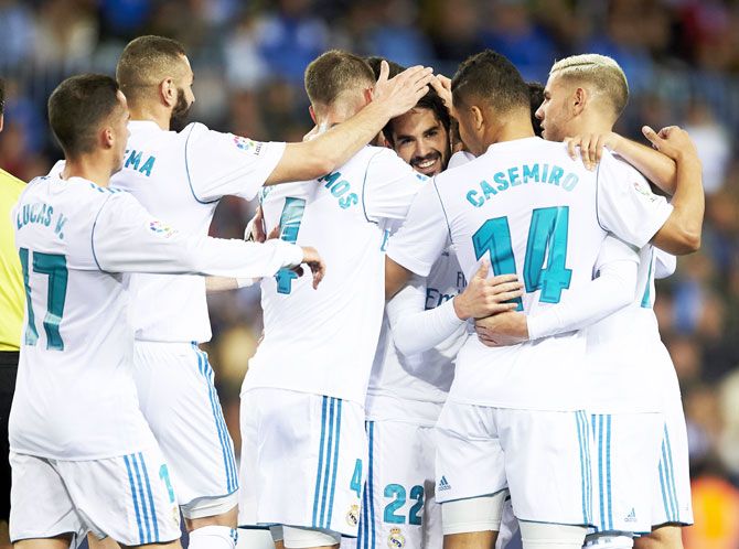 Real Madrid's Isco Alarcon celebrates after scoring against Malaga CF during the La Liga match at Estadio La Rosaleda in Malaga on Sunday