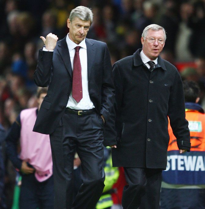 Former Manchester United boss Sir Alex Ferguson and Arsene Wenger during a match at Old Trafford on April 29, 2009