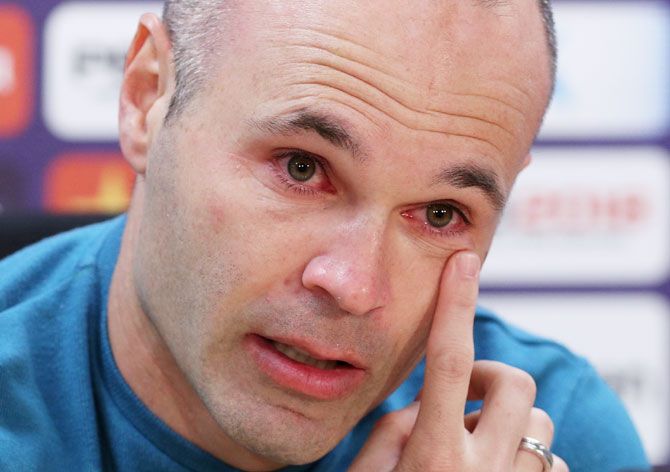 FC Barcelona's Andres Iniesta cries during a press conference annoucing his departure from the club
