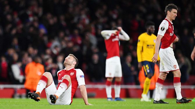 Arsenal's Shkodran Mustafi and Laurent Koscielny react after their Europa League Semi Final First Leg match against Atletico Madrid at Emirates Stadum on Thursday