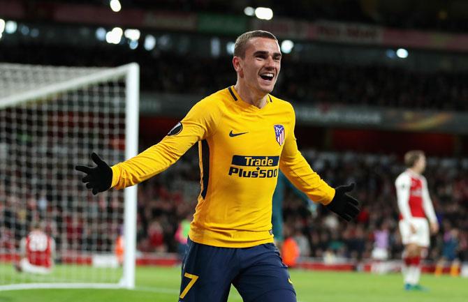 Atletico Madrid's Antoine Griezmann celebrates after scoring the equaliser against Arsenal