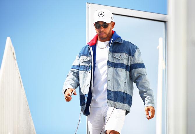 Mercedes GP's British driver Lewis Hamilton walks in the Paddock during previews ahead of the Azerbaijan Formula One Grand Prix at Baku City Circuit in Baku, Azerbaijan, on Thursday