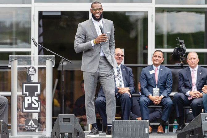 LeBron James addresses the crowd during the opening ceremonies of the I Promise School in Akron, Ohio, on Monday