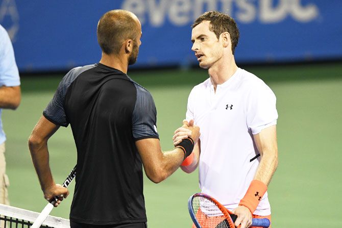 Andy Murray is congratulated by Romania's Marius Copil after winning the marathon match at the Citi Open that lasted over three hours on Thursday