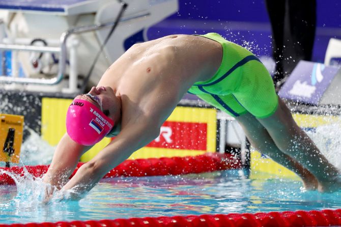Russia's Kliment Kolesnikov competes in the Men's 100m Backstroke swimming Semi-Final 1 at Tollcross International Swimming Centre in Glasgow on August 5
