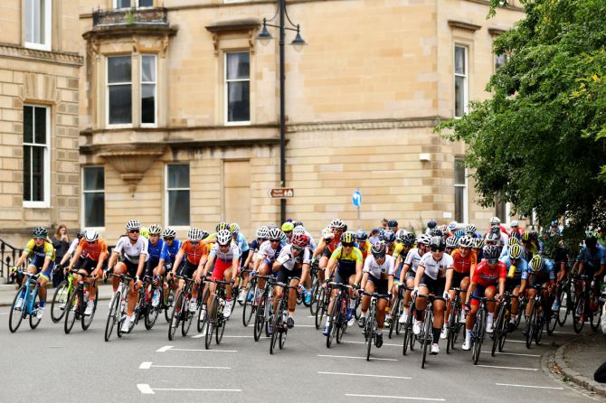 A general view as the peloton of women cyclists pass during a road race in Glasgow on August 5