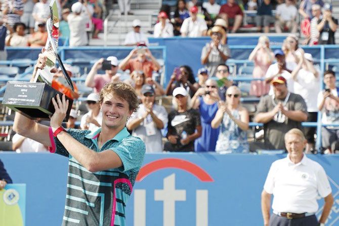 Germany's Alexander Zverev holds the Donald Dell Trophy after he beat Australia's Alex de Minaur to win the Citi Open final at Rock Creek Park Tennis Center in Washington on Sunday
