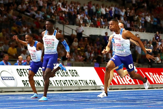 Great Britain'S Zharnel Hughes crosses the line to win the Gold medal as compatriot Reece Prescod crosses to win the Silver medal in the Men's 100 metres final on Day one of the 24th European Athletics Championships at Olympiastadion in Berlin on Tuesday
