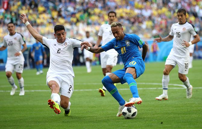 Brazil's Neymar wins the ball in a challenge with Costa Rica's Jonny Acosta during the 2018 FIFA World Cup Russia Group E match at Saint Petersburg Stadium on June 22, 2018