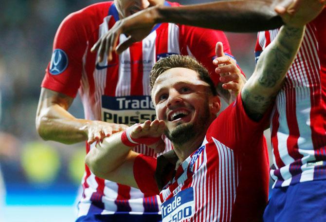 Atletico Madrid's Saul Niguez celebrates scoring their third goal against Real Madrid on Wednesday