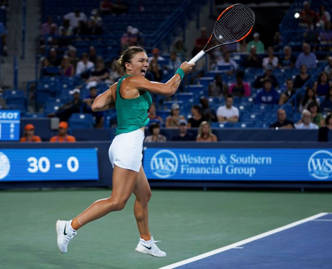 Simona Halep returns a shot against Ajla Tomljanovic in the Western and Southern tennis open at Lindner Family Tennis Center in Mason, Ohio, on Thursday