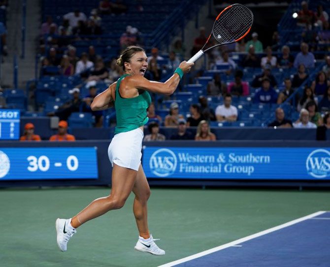 Simona Halep returns a shot against Ajla Tomljanovic in the Western and Southern tennis open at Lindner Family Tennis Center in Mason, Ohio, on Thursday