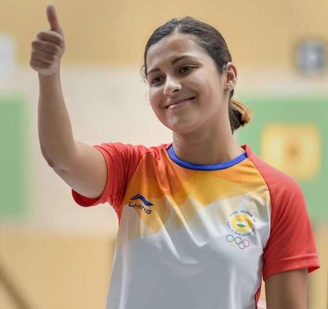 Heena Sidhu shows off her bronze medal on the podium at the Asian Games on Friday