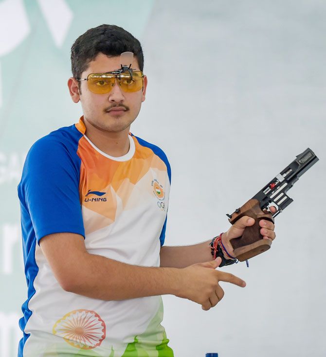 Indian shooter Anish looks disappointed after he failed to qualify for the finals of men's 25m Rapid Fire Pistol event at the 18th Asian Games in Palembang, in Indonesia on Saturday