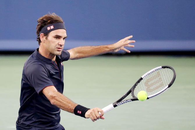 Roger Federer believes Rafael Nadal and Novak Djokovic are favourites to win the US Open