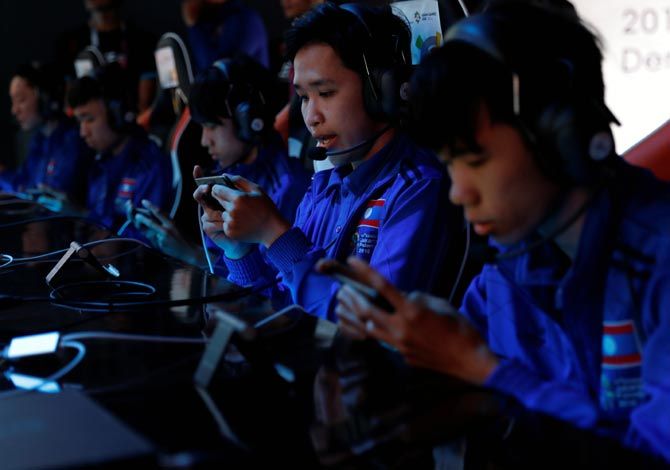 Players compete in Arena Of Valor tournament as esports made a splashy debut as an exhibition event at the 2018 Asian Games