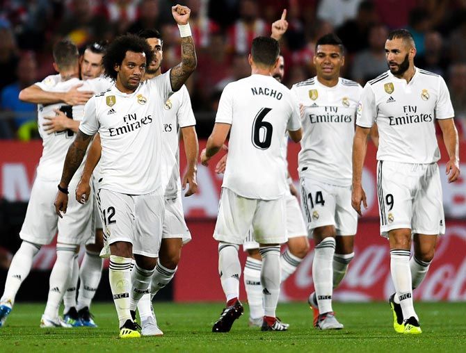 Real Madrid players celebrate a goal