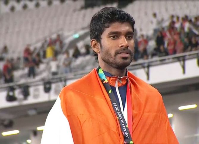 India's Jinson Johnson during the medal ceremony on Thursday