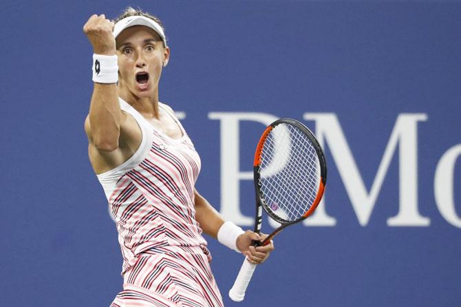 Ukraine's Lesia Tsurenko celebrates match point against Denmark's Caroline Wozniacki in their second round match