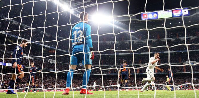 Real Madrid's Lucas Vazquez celebrates scoring their second goal against Valencia at Santiago Benabeu in Madrid on Saturday