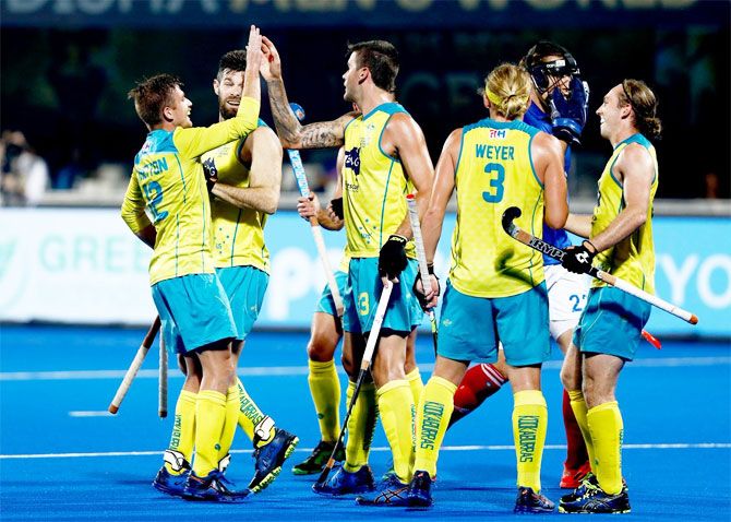 Australia players celebrate a goal against France during the Hockey World Cup quarter-final on Tuesday