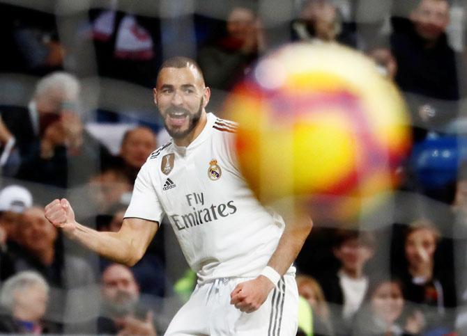 Real Madrid's Karim Benzema celebrates on scoring against Rayo Vallecano during the La Liga match at Santiago Bernabeu in Madrid on Saturday