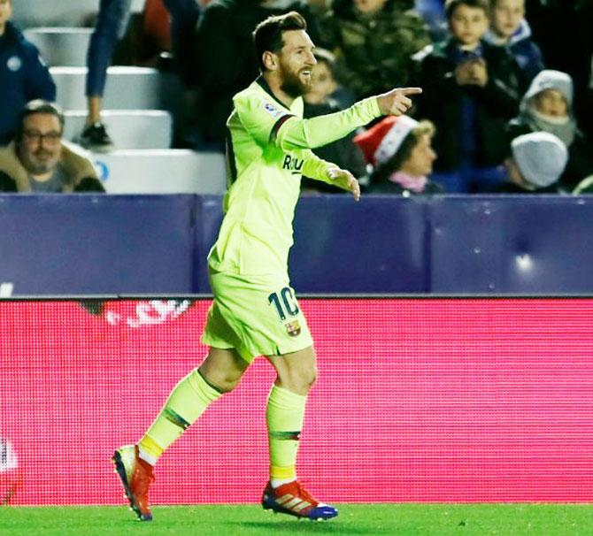 FC Barcelona's Lionel Messi celebrates after scoring against Levante during their La Liga match on Sunday