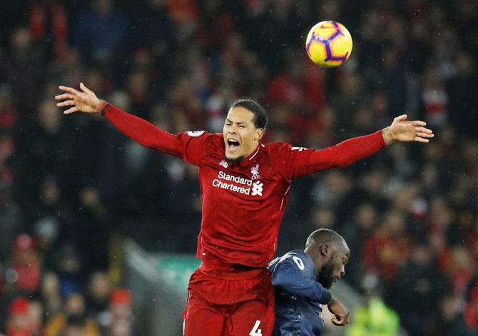 Liverpool's Virgil van Dijk and Manchester United's Romelu Lukaku in action