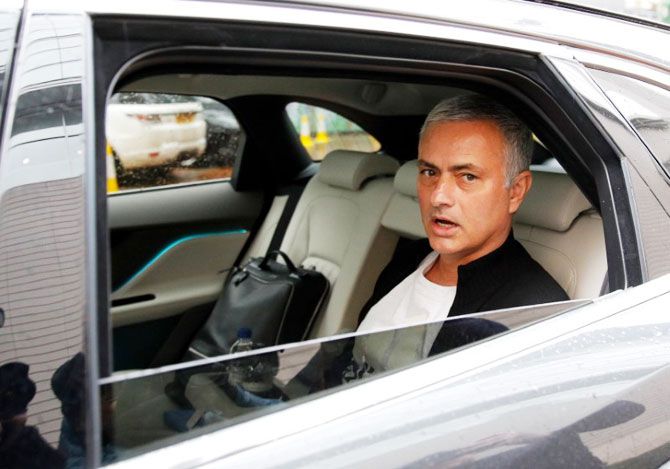 Jose Mourinho is driven away from his accommodation after leaving his job as Manchester United's manager, in Manchester, Britain, on Tuesday