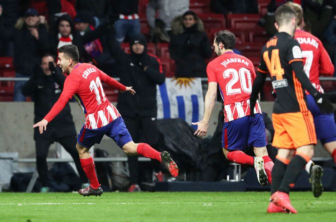 Atletico Madrid's Angel Correa celebrates scoring their first goal against Valencia at the Wanda Metropolitano in Madrid, Spain, on Sunday