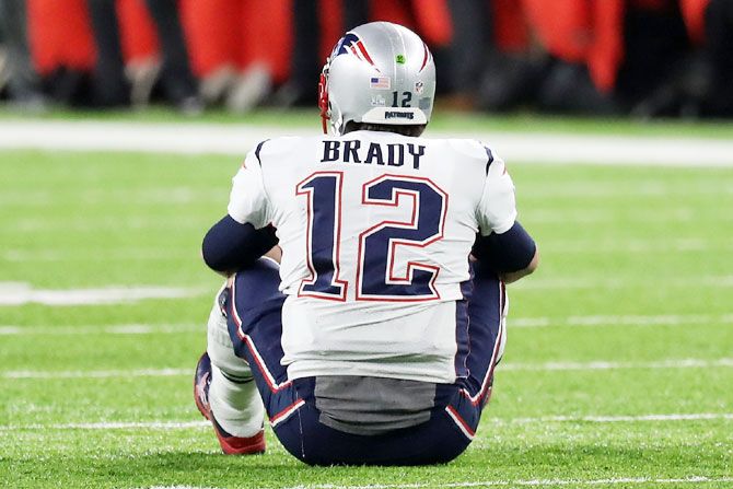 Tom Brady #12 of the New England Patriots reacts after fumbling the ball during the fourth quarter against the Philadelphia Eagles in Super Bowl LII final at US Bank Stadium on Sunday