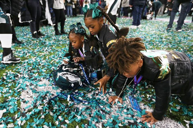 Philadelphia Eagles cornerback Patrick Robinson's (not pictured) kids play in confetti