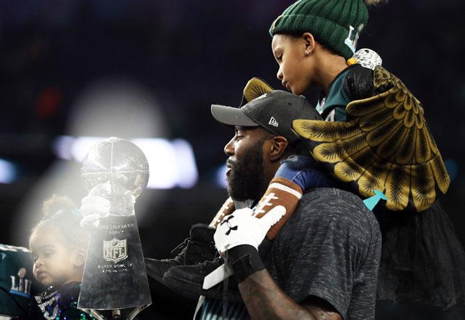 Malcolm Jenkins #27 of the Philadelphia Eagles kisses the Vince Lombardi Trophy