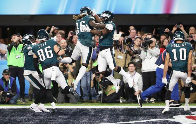 Philadelphia Eagles’ Corey Clement celebrates scoring a touchdown with Jay Ajayi