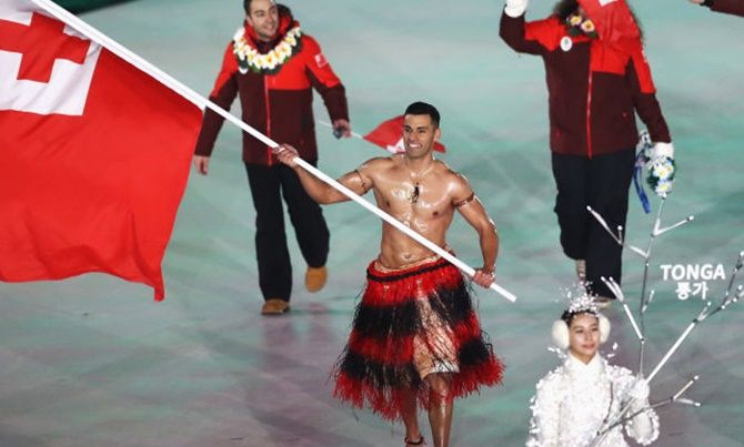 Flag bearer Pita Taufatofua of Tonga at the 2018 Winter Olympics in PyeongChang