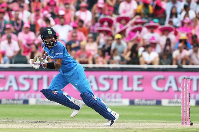 India captain Virat Kohli takes a run en route his 75