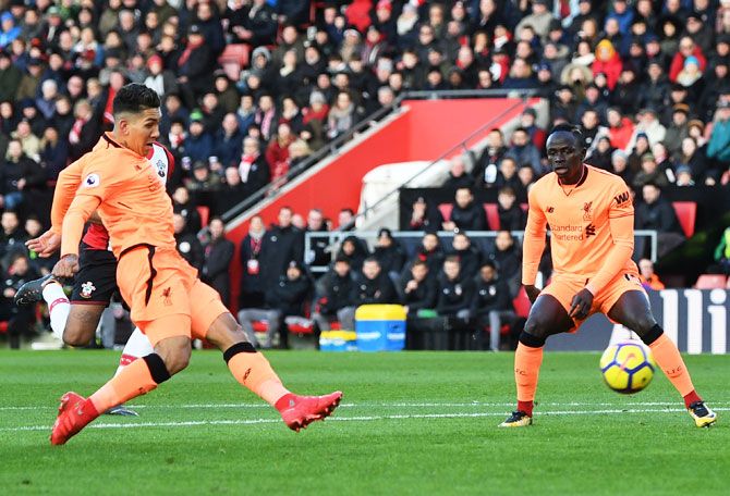 Liverpool's Roberto Firmino scores his side's first goal against Southampton at St Mary's Stadium in Southampton