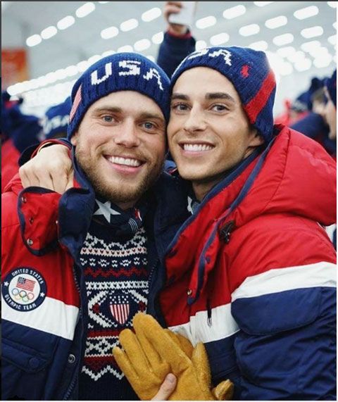 Gus Kensworthy and US figure skater Adam Rippon pose for a picture at the Winter Games opening ceremony on Friday