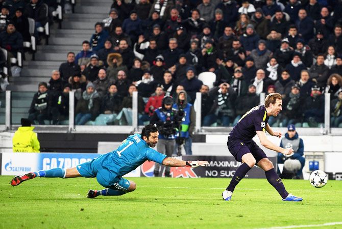Tottenham Hotspur's Harry Kane scores his side's first goal past Juventus 'keeper Gianluigi Buffon at Allianz Stadium in Turin, Italy, on Tuesday
