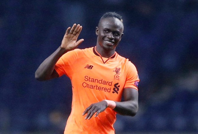 Liverpool's hat-trick hero Sadio Mane celebrates at the end of the Champions League last 16 first leg tie against Porto