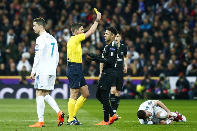 PSG's Neymar is shown a yellow card during their UEFA Champions League match against Real Madrid on Wednesday
