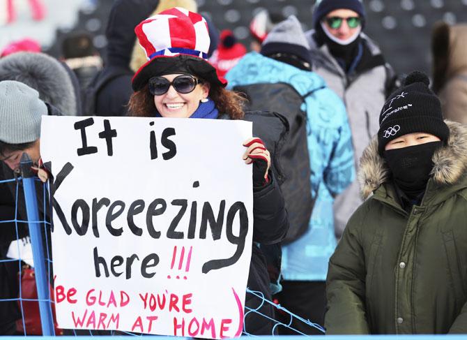 Spectators wait in the cold at the Phoenix Snow Park at the Winter Olympic Games in Pyeongchang Feb 11