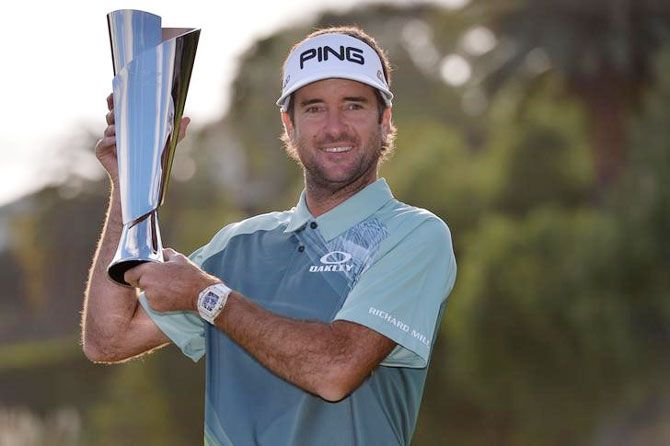 USA's Bubba Watson poses with the championship trophy following the final round of the Genesis Open golf tournament at Riviera Country Club at Pacific Palisades in California on Sunday